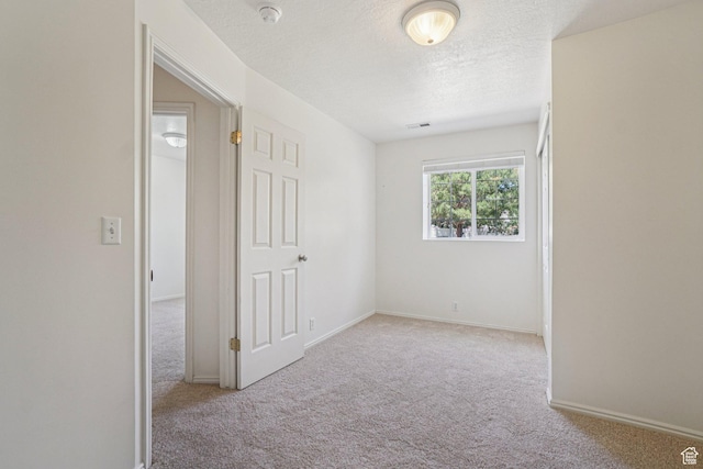 4964 Boulder Glen Cir, West Jordan, UT 84088 - carpeted empty room featuring a smoke detector and a textured ceiling
