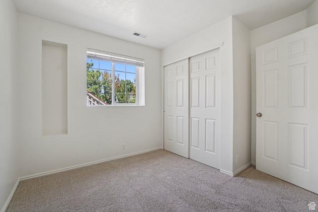 4964 Boulder Glen Cir, West Jordan, UT 84088 - unfurnished bedroom featuring carpet flooring and a closet