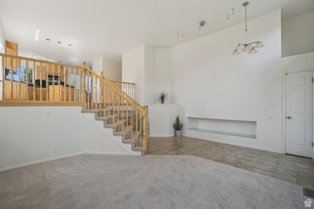 4964 Boulder Glen Cir, West Jordan, UT 84088 - unfurnished living room featuring stairway, tile patterned floors, a chandelier, a high ceiling, and carpet
