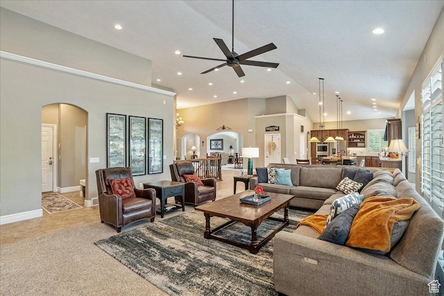 12937 S Old Country Ct W, Riverton, UT 84065 - living room featuring arched walkways, recessed lighting, ceiling fan, high vaulted ceiling, and light carpet