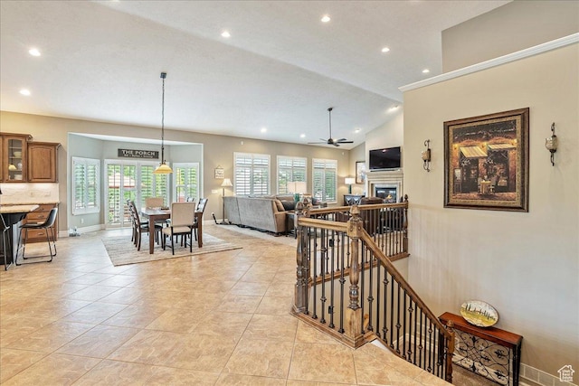 12937 S Old Country Ct W, Riverton, UT 84065 - dining space with ceiling fan, recessed lighting, a glass covered fireplace, lofted ceiling, and light tile patterned flooring