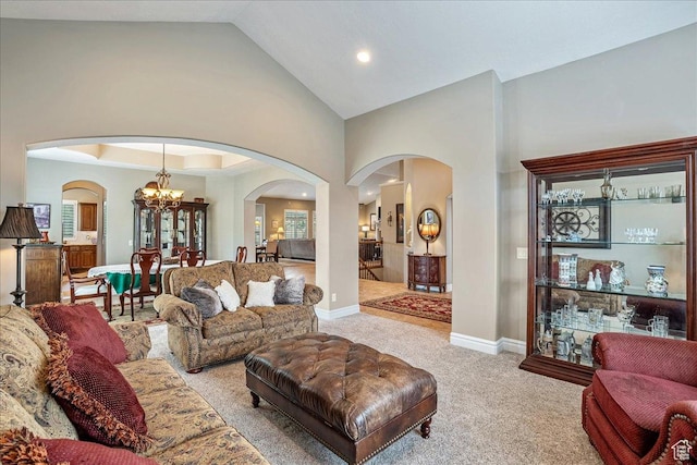 12937 S Old Country Ct W, Riverton, UT 84065 - living room with arched walkways, a chandelier, light carpet, high vaulted ceiling, and recessed lighting