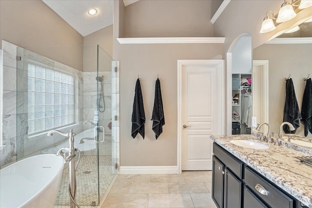 12937 S Old Country Ct W, Riverton, UT 84065 - bathroom with a soaking tub, a spacious closet, a shower stall, vanity, and lofted ceiling