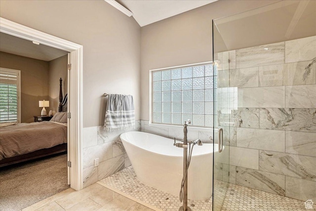 12937 S Old Country Ct W, Riverton, UT 84065 - ensuite bathroom with a soaking tub, a stall shower, tile walls, tile patterned flooring, and a wainscoted wall