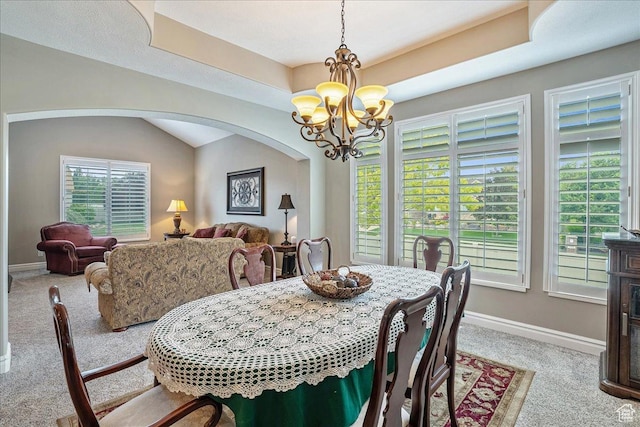 12937 S Old Country Ct W, Riverton, UT 84065 - dining space with carpet flooring, a chandelier, and arched walkways
