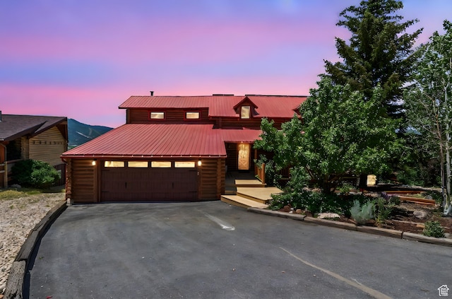 6385 Mountain View Dr, Park City, UT 84098 - view of front of home with driveway, log exterior, a garage, and a metal roof