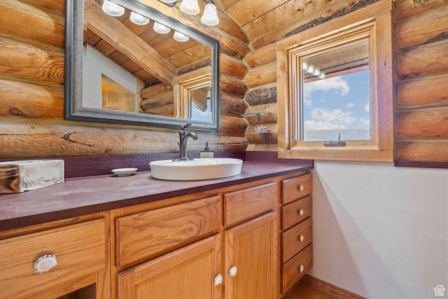 6385 Mountain View Dr, Park City, UT 84098 - bathroom with log walls, wood ceiling, and vanity