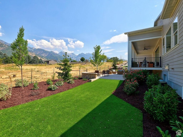 7817 S Danish Pine Ln Unit 101, Cottonwood Heights, UT 84121 - view of yard with a ceiling fan, a mountain view, and a patio