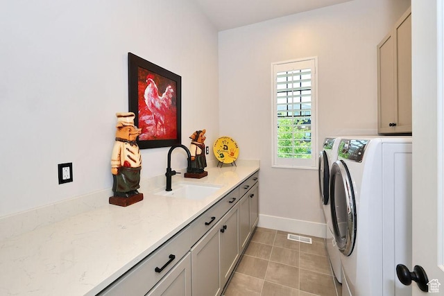 7817 S Danish Pine Ln Unit 101, Cottonwood Heights, UT 84121 - laundry area featuring washer and dryer, cabinet space, and light tile patterned flooring