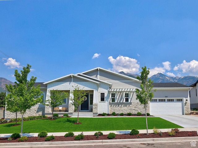 7817 S Danish Pine Ln Unit 101, Cottonwood Heights, UT 84121 - craftsman inspired home featuring stone siding, a mountain view, a front lawn, a garage, and driveway
