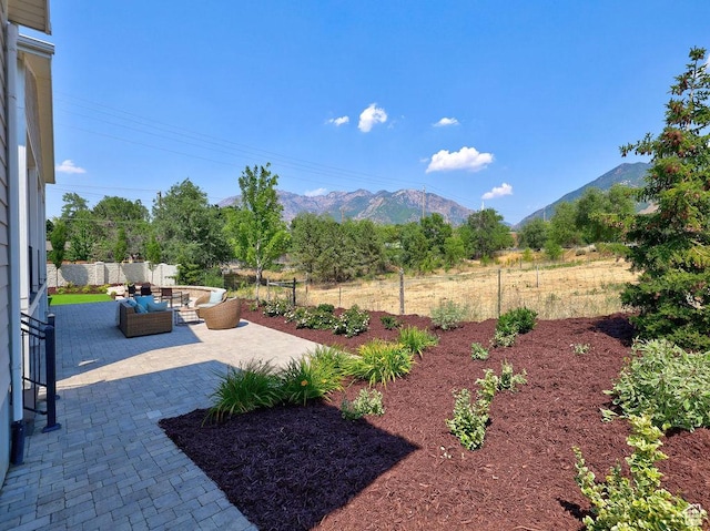 7817 S Danish Pine Ln Unit 101, Cottonwood Heights, UT 84121 - view of yard with an outdoor living space, a mountain view, and a patio area