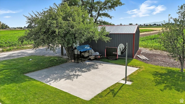 11395 N 4400 W, Tremonton, UT 84337 - view of patio / terrace featuring a rural view, an outdoor structure, a mountain view, and an outbuilding