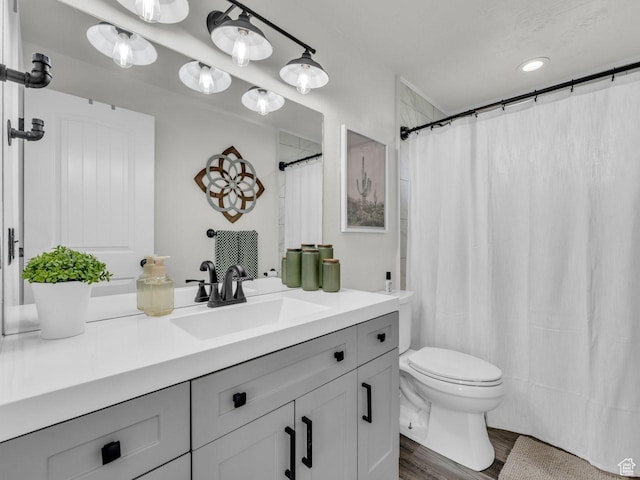 4332 W Losee Dr, West Valley City, UT 84120 - bathroom featuring vanity, wood finished floors, and a shower with shower curtain