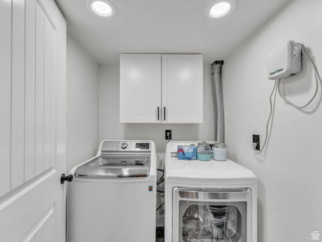 4332 W Losee Dr, West Valley City, UT 84120 - laundry room featuring cabinet space, washing machine and clothes dryer, and recessed lighting