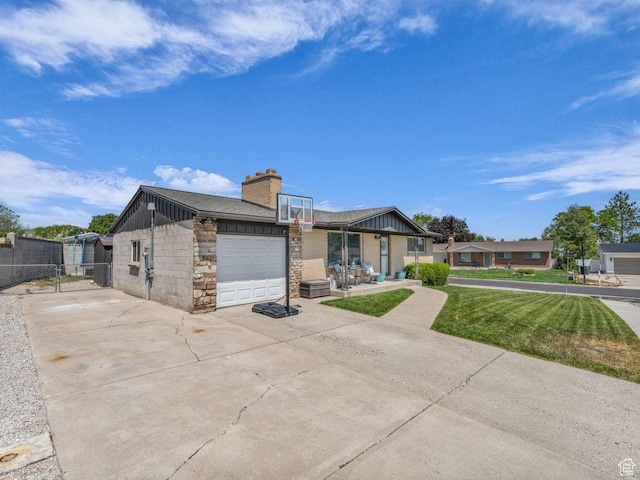 4332 W Losee Dr, West Valley City, UT 84120 - view of front of property with an attached garage, driveway, a chimney, stone siding, and board and batten siding