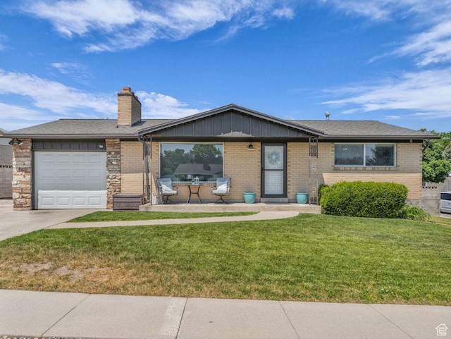 4332 W Losee Dr, West Valley City, UT 84120 - ranch-style home featuring concrete driveway, a garage, a front yard, brick siding, and a chimney