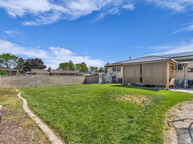 4332 W Losee Dr, West Valley City, UT 84120 - fenced yard featuring a sunroom and a patio area