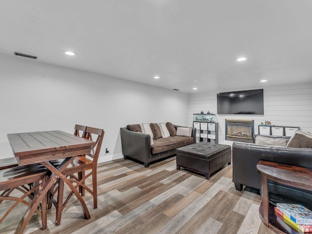 4332 W Losee Dr, West Valley City, UT 84120 - living room with light wood-style floors, recessed lighting, and a glass covered fireplace
