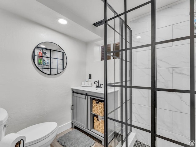 4332 W Losee Dr, West Valley City, UT 84120 - bathroom featuring tiled shower, wood finished floors, vanity, and recessed lighting