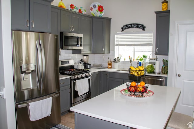 1415 N 3300 W, Provo, UT 84601 - kitchen with stainless steel appliances, tasteful backsplash, gray cabinetry, and light countertops