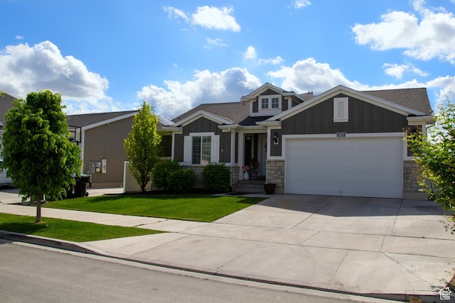 1415 N 3300 W, Provo, UT 84601 - craftsman-style home with board and batten siding, a garage, a front yard, concrete driveway, and stone siding