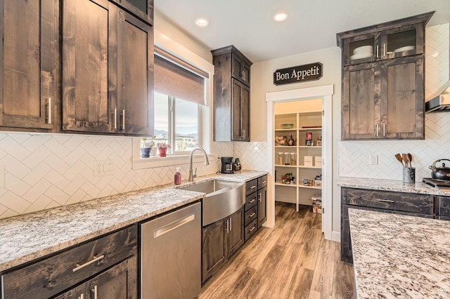 4909 N Cliffrose Dr, Eagle Mountain, UT 84005 - kitchen featuring stainless steel dishwasher, decorative backsplash, light stone countertops, light wood finished floors, and recessed lighting