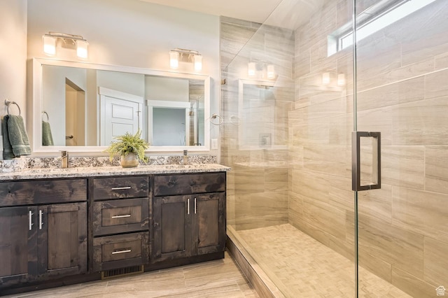 4909 N Cliffrose Dr, Eagle Mountain, UT 84005 - bathroom with a tile shower and double vanity