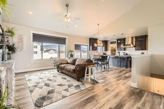 4909 N Cliffrose Dr, Eagle Mountain, UT 84005 - living room featuring ceiling fan, light wood-type flooring, recessed lighting, and high vaulted ceiling