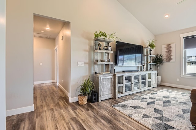 4909 N Cliffrose Dr, Eagle Mountain, UT 84005 - unfurnished living room with wood finished floors, lofted ceiling, and recessed lighting