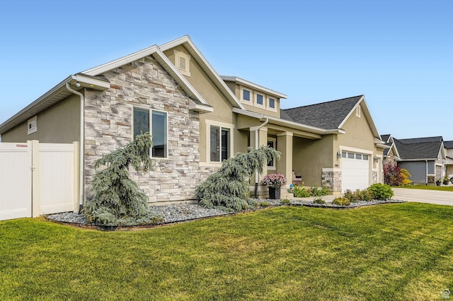 4909 N Cliffrose Dr, Eagle Mountain, UT 84005 - view of front of property with stone siding, stucco siding, an attached garage, and driveway