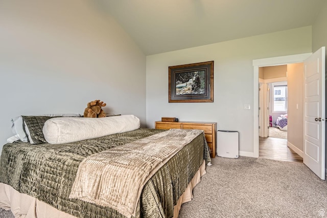 4909 N Cliffrose Dr, Eagle Mountain, UT 84005 - bedroom featuring light colored carpet and vaulted ceiling