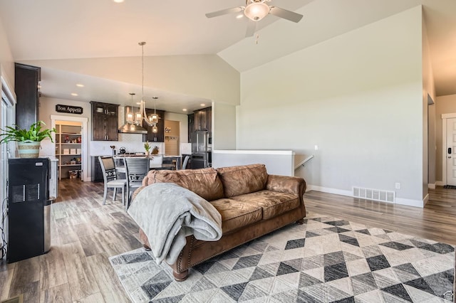 4909 N Cliffrose Dr, Eagle Mountain, UT 84005 - living area with light wood-type flooring, ceiling fan, a chandelier, recessed lighting, and high vaulted ceiling