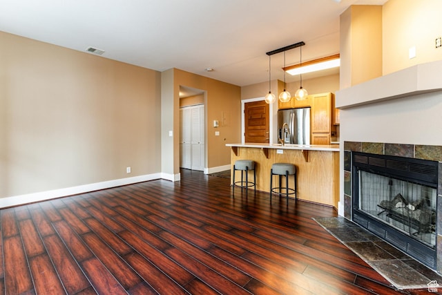 8050 Gambel Dr Unit O-1, Park City, UT 84098 - unfurnished living room featuring dark wood-style flooring and a fireplace