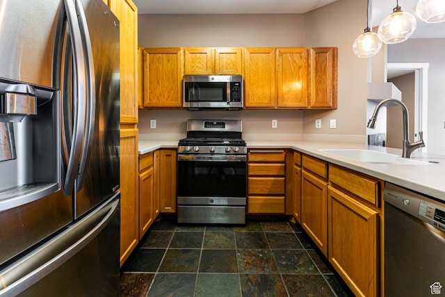 8050 Gambel Dr Unit O-1, Park City, UT 84098 - kitchen featuring appliances with stainless steel finishes, light countertops, brown cabinets, and dark stone finish floors