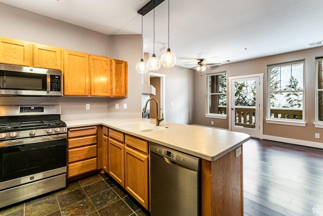 8050 Gambel Dr Unit O-1, Park City, UT 84098 - kitchen with appliances with stainless steel finishes, a peninsula, light countertops, a ceiling fan, and pendant lighting