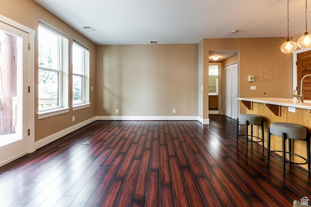 8050 Gambel Dr Unit O-1, Park City, UT 84098 - unfurnished living room featuring dark wood-style floors and baseboards