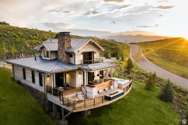 7394 E Moon Light Dr Unit 326A, Heber City, UT 84032 - rear view of house featuring a balcony, a standing seam roof, a hot tub, a metal roof, and a yard