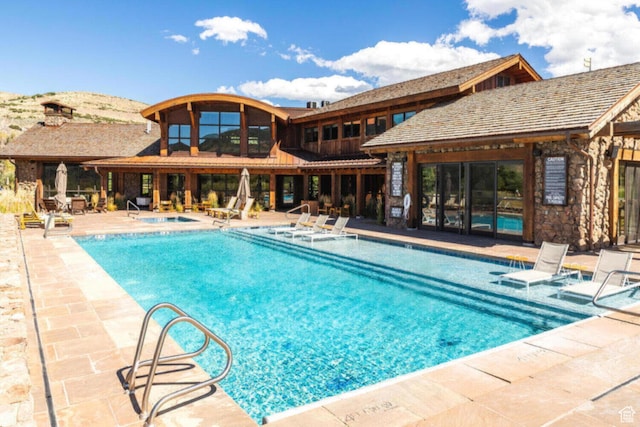 7394 E Moon Light Dr Unit 326A, Heber City, UT 84032 - community pool with a patio area and a community hot tub