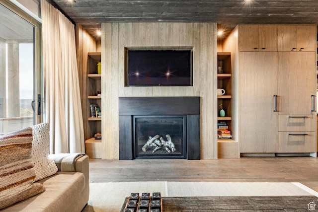 7394 E Moon Light Dr Unit 326A, Heber City, UT 84032 - living room with built in features, wood finished floors, and a fireplace