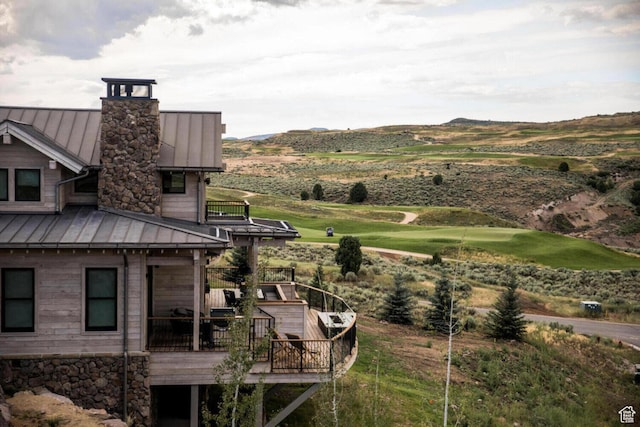 7394 E Moon Light Dr Unit 326A, Heber City, UT 84032 - rear view of house with a standing seam roof, a metal roof, a deck with mountain view, and a chimney
