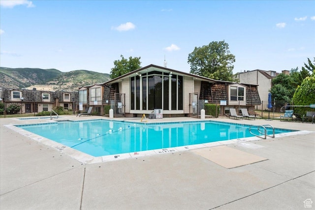 88 W 50 S Unit C9, Centerville, UT 84014 - community pool featuring a mountain view, a patio, and a sunroom
