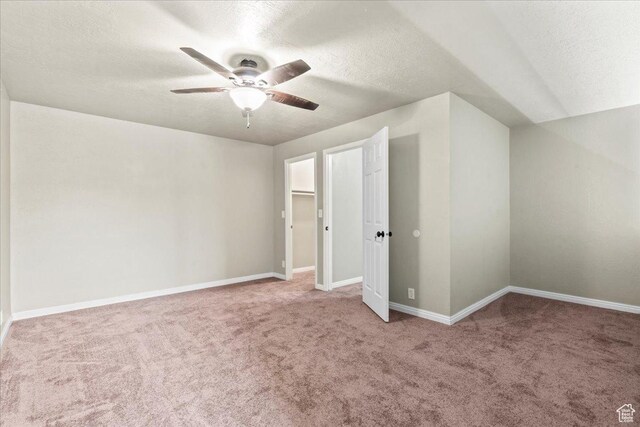88 W 50 S Unit C9, Centerville, UT 84014 - unfurnished bedroom with carpet flooring, a textured ceiling, and ceiling fan
