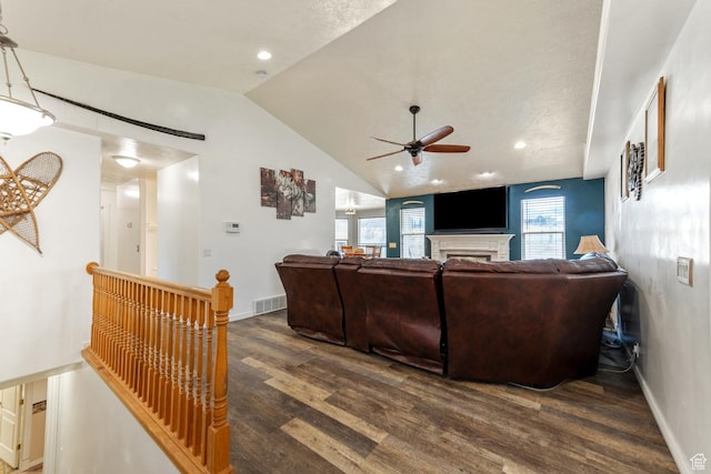 29 N Meadowlark Cir, Grantsville, UT 84029 - living room with dark wood-style floors, vaulted ceiling, a ceiling fan, a fireplace, and recessed lighting