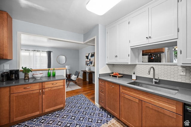 817 N Catherine St, Salt Lake City, UT 84116 - kitchen featuring tasteful backsplash, white cabinets, dark countertops, and wood finished floors
