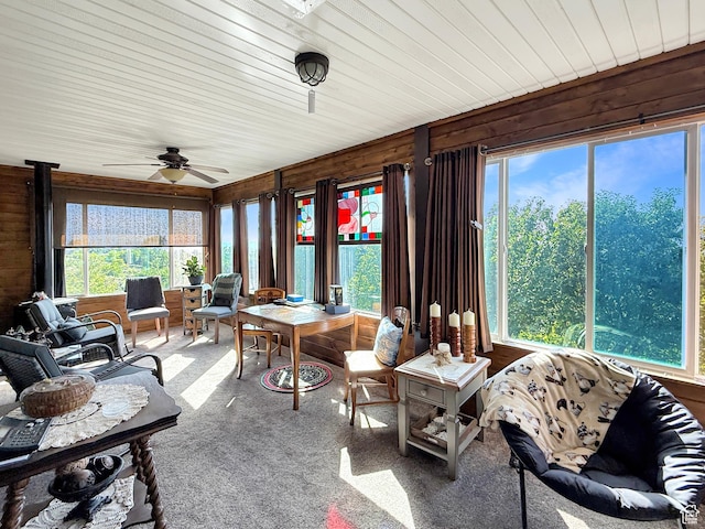 280 W 2400 S, Perry, UT 84302 - sunroom / solarium featuring wood walls, a wood stove, and carpet floors