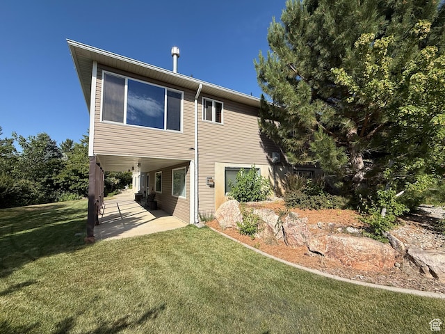 280 W 2400 S, Perry, UT 84302 - back of house with a patio area and a yard