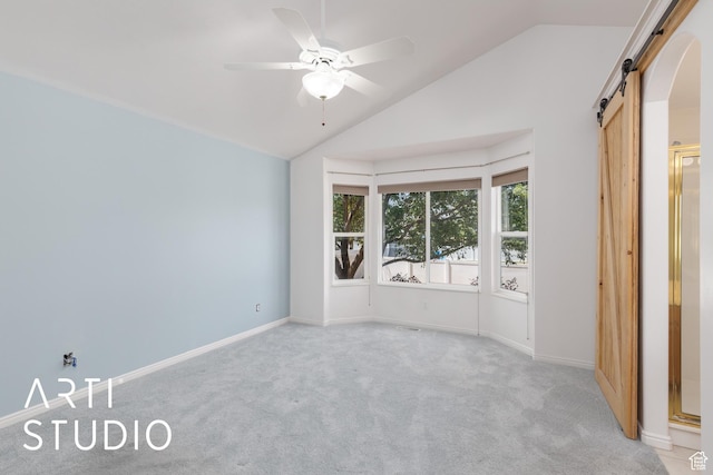 1209 N 1120 W, Clinton, UT 84015 - unfurnished bedroom featuring a barn door, light carpet, vaulted ceiling, and a ceiling fan