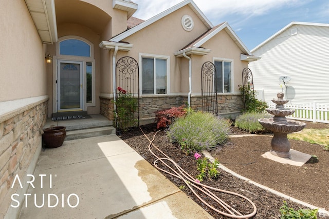 1209 N 1120 W, Clinton, UT 84015 - doorway to property featuring stone siding and stucco siding