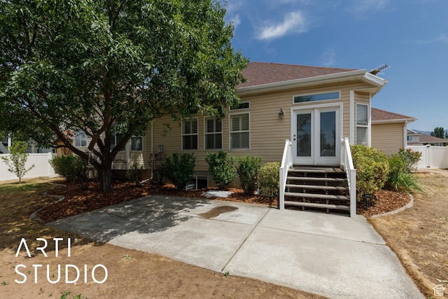 1209 N 1120 W, Clinton, UT 84015 - view of front of house featuring a shingled roof and a patio area