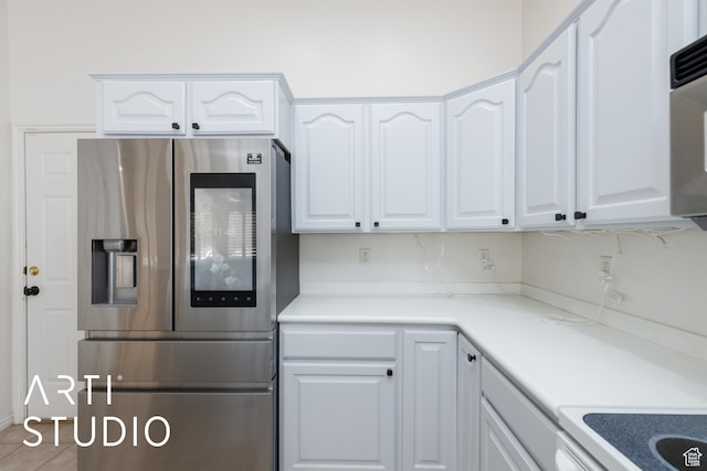 1209 N 1120 W, Clinton, UT 84015 - kitchen with stainless steel fridge, white cabinets, and light countertops
